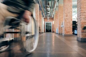 Wheelchair rolling through hallway