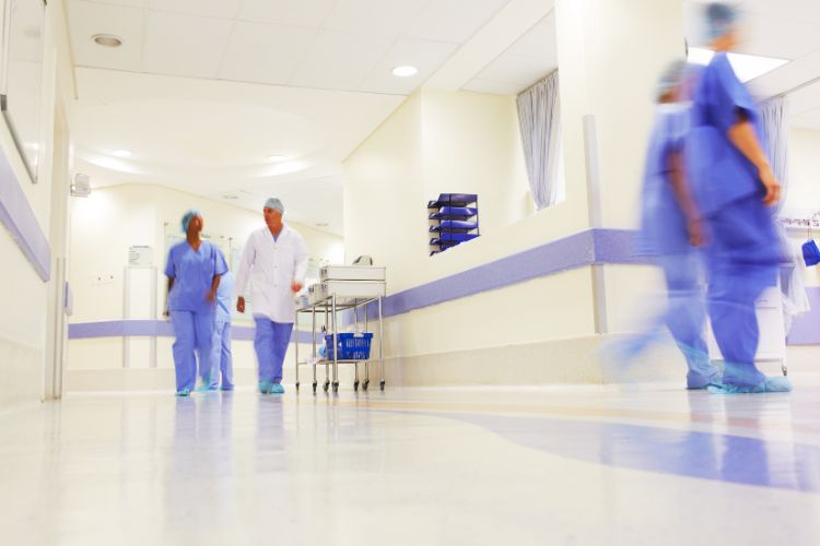 doctors walking near hospital wall protection